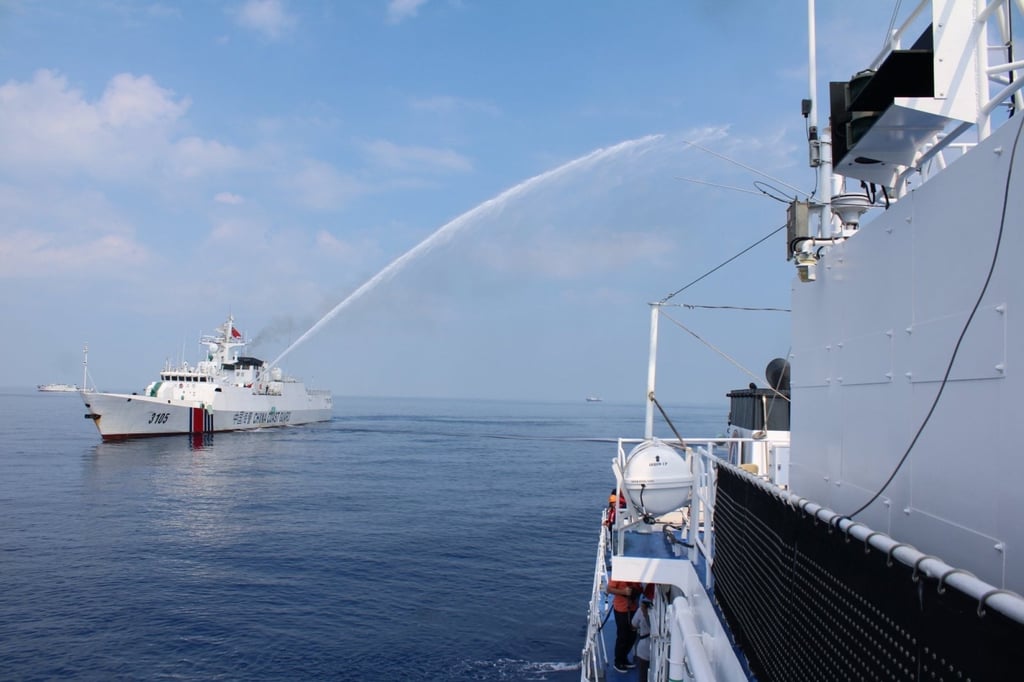 A Chinese coastguard ship fires a water cannon on a Philippine coastguard vessel at the vicinity of Scarborough Shoal in the disputed South China Sea, on April 30. Photo: EPA-EFE A Chinese coastguard ship fires a water cannon on a Philippine coastguard vessel at the vicinity of Scarborough Shoal in the disputed South China Sea, on April 30. Photo: EPA-EFE