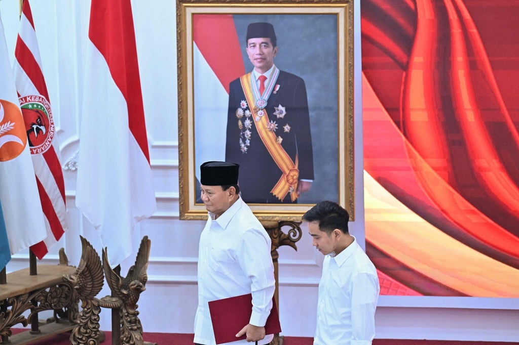 Indonesia’s president-elect Prabowo Subianto (left) and vice-president elect Gibran Rakabuming Raka walk past a picture of Indonesian President Joko Widodo, also father of Gibran. Photo: AFP Indonesia’s president-elect Prabowo Subianto (left) and vice-president elect Gibran Rakabuming Raka walk past a picture of Indonesian President Joko Widodo, also father of Gibran. Photo: AFP