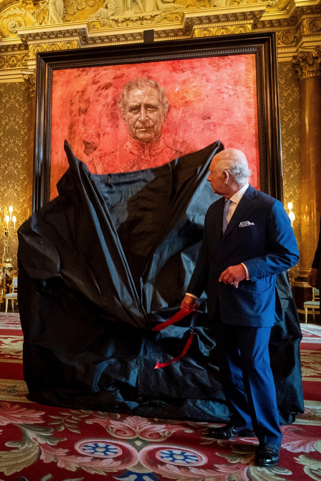 Britain’s King Charles unveils his portrait by artist Jonathan Yeo’s at Buckingham Palace on Tuesday. Photo: AP