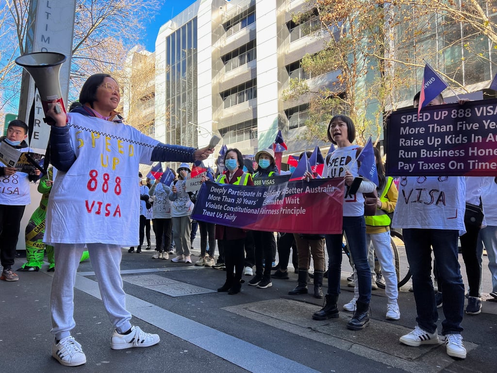 Chinese migrants protest against Australia’s policy shift on the investment visa scheme, as they march outside the Australian Broadcasting Corporation office in Sydney, Australia, in June 2023. Photo: Reuters