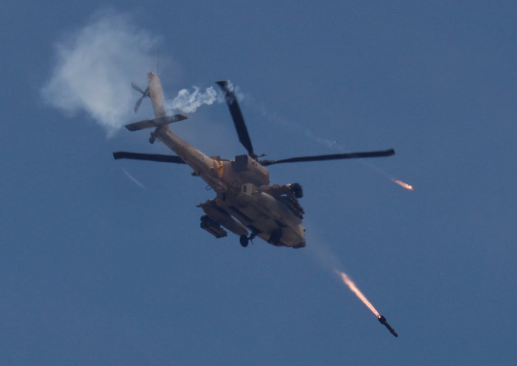 An Israeli military Apache helicopter fires missiles towards Gaza. Photo: Reuters An Israeli military Apache helicopter fires missiles towards Gaza. Photo: Reuters