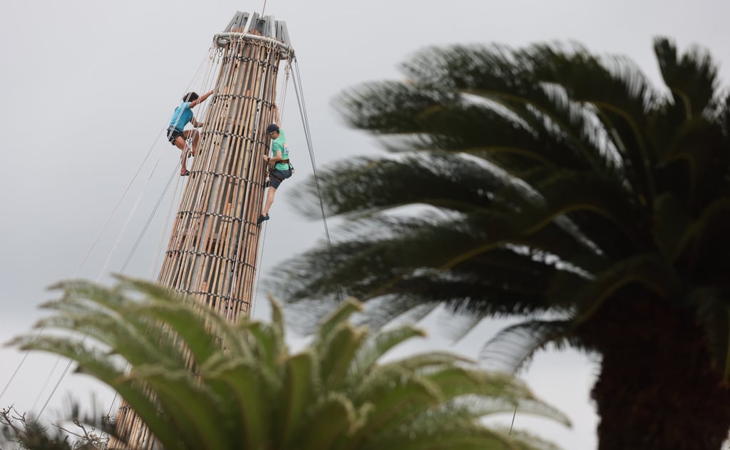 Would-be winners of the traditional bun scrambling competition, part of the Cheung Chau island Da Jiu Festival, work on qualification for the main event. Photo: May Tse