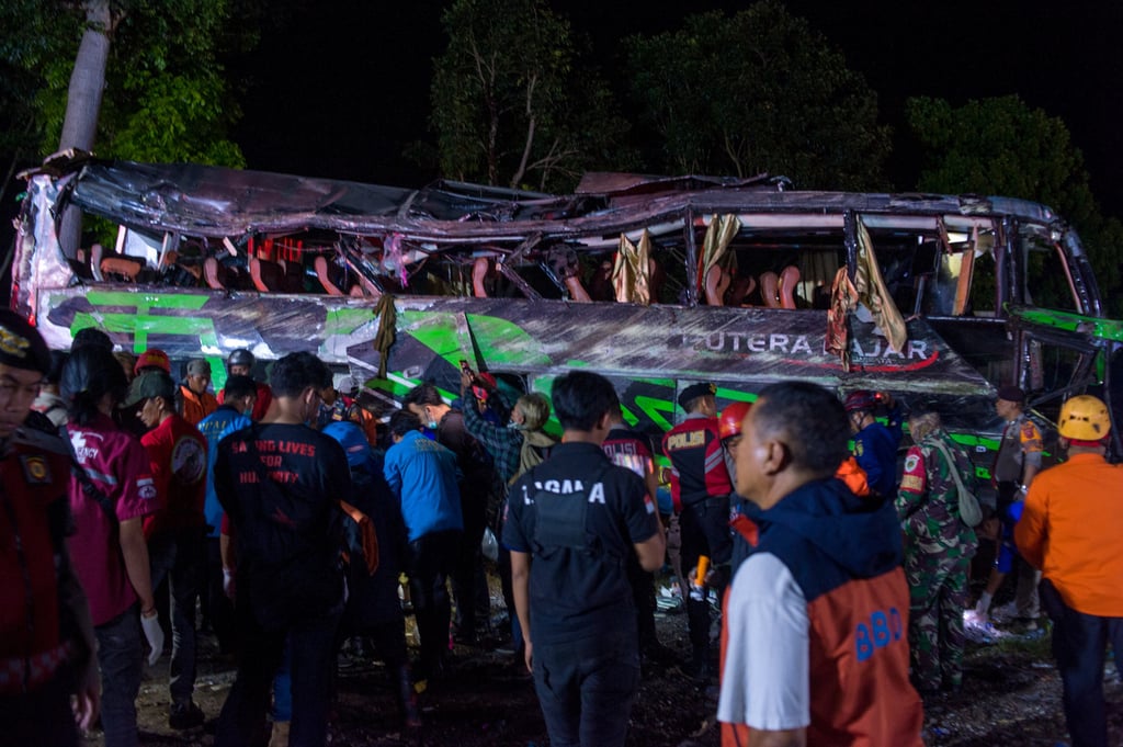 People working around a damaged bus after an accident at Palasari Village in Subang regency, West Java, Indonesia, on Saturday. Photo: Xinhua