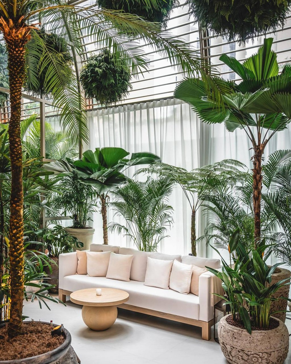The Singapore Edition’s greenery-filled Lobby Bar; it features over 300 Southeast Asian plants and over 160 suspended fern preserved spheres, according to its official Instagram. Photo: @singaporeedition/Instagram