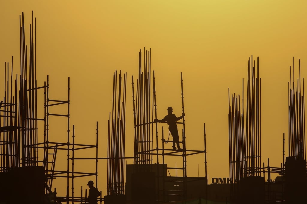 A labourer works at a construction site on a hot afternoon in Ahmedabad, Gujarat, India. Photo: EPA-EFE