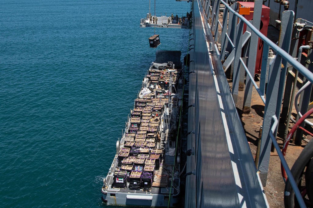 Humanitarian aid being loaded for transport. Photo: US Central Command via AFP