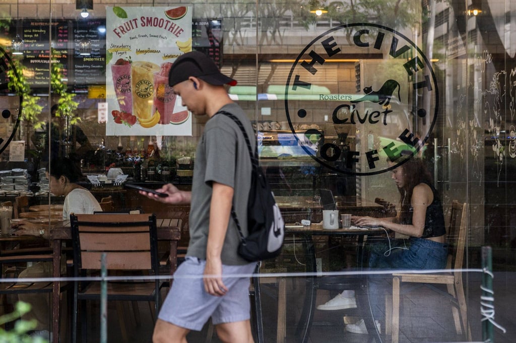 Customers at a cafe at Cebu IT Park in Cebu City. Section 154 of the Philippines’ penal code penalises the publication of false news that endangers public order or harms the state’s interests, with a maximum jail term of six months. Photo: Bloomberg
