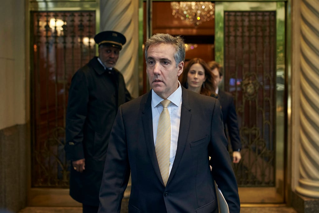 Michael Cohen leaves his apartment building on his way to court in New York on Thursday. Photo: AP