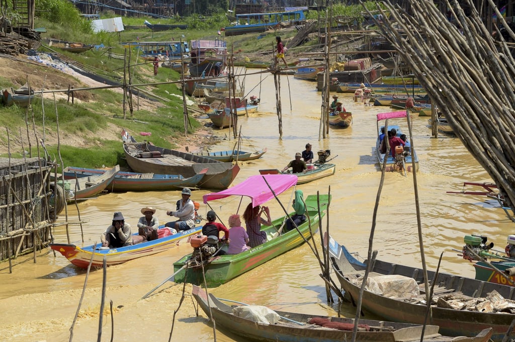 Boats move along a canal in Siem Reap. The Funan Techo Canal would establish Cambodia’s first-ever inland waterway link to seaports in Sihanoukville and Kampot. Photo: AFP
