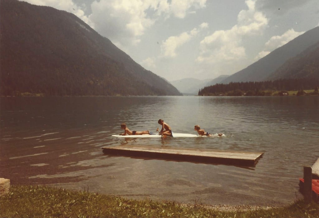 Simon Lorenz as a child (centre) and brother Kevin (left) playing on Lake Weissensee, in Austria, around 1985. Photo: Simon Lorenz Simon Lorenz as a child (centre) and brother Kevin (left) playing on Lake Weissensee, in Austria, around 1985. Photo: Simon Lorenz