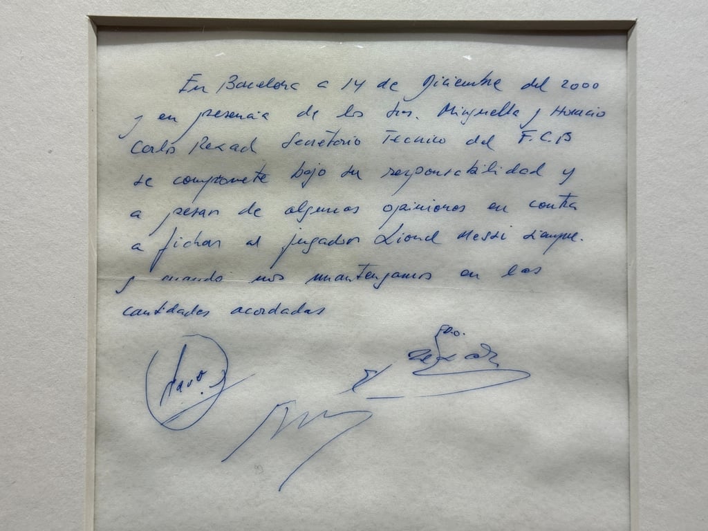 A signed and laminated copy of the napkin linking a 13-year-old Lionel Messi to Barcelona. Photo: Reuters