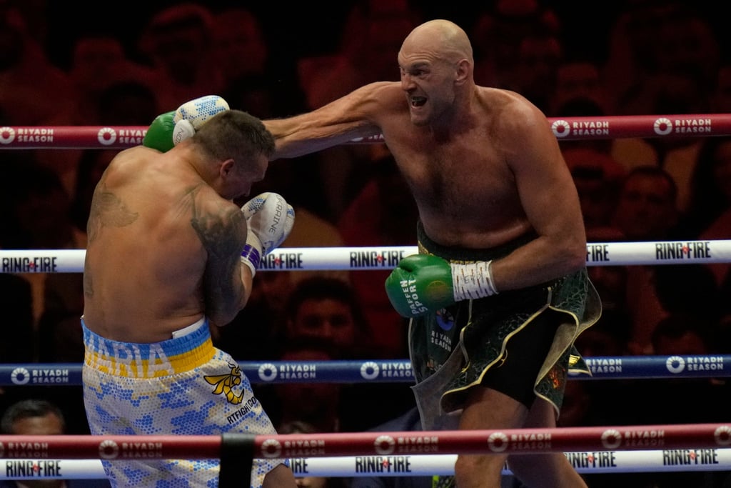 Tyson Fury (right) punches Oleksandr Usyk during their heavyweight world championship fight at the Kingdom Arena in Riyadh. Photo: AP Tyson Fury (right) punches Oleksandr Usyk during their heavyweight world championship fight at the Kingdom Arena in Riyadh. Photo: AP