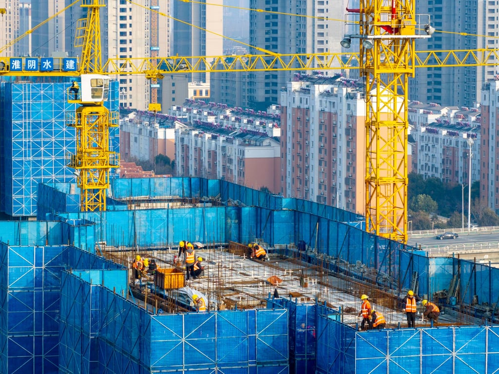 Construction of a resettlement housing project is seen along the Beijing-Hangzhou Grand Canal in Huaian, China, in March 2024. Photo: Getty Images