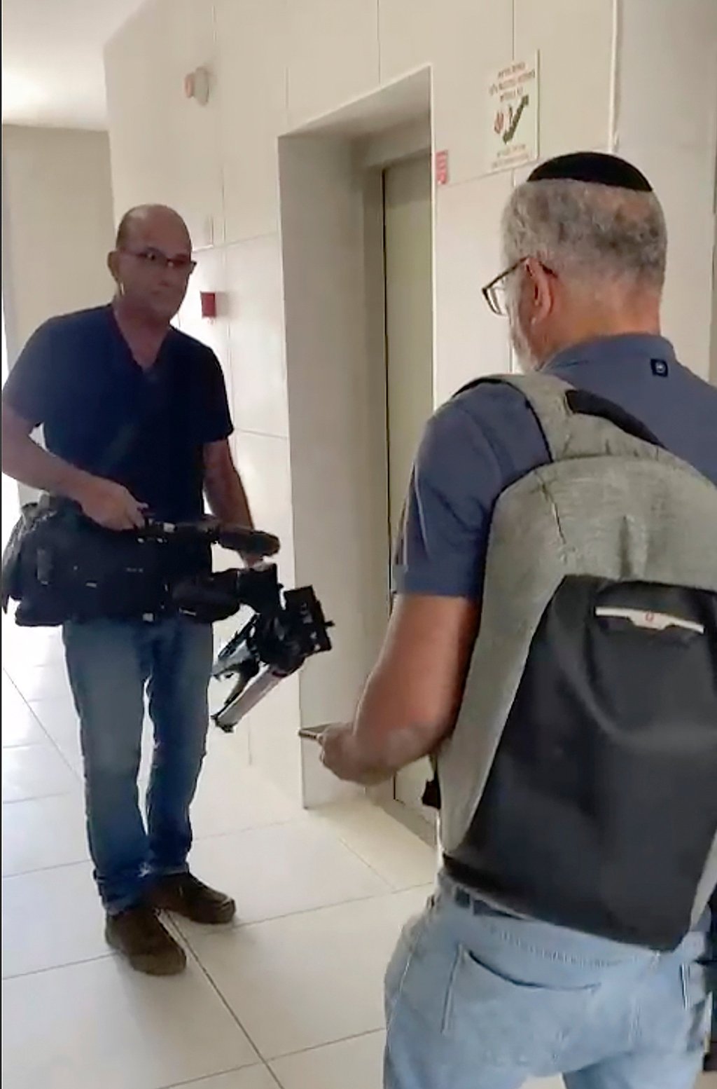 Israeli officials seize AP video equipment from an apartment block in Sderot, Southern Israel, on Tuesday. Photo: AP