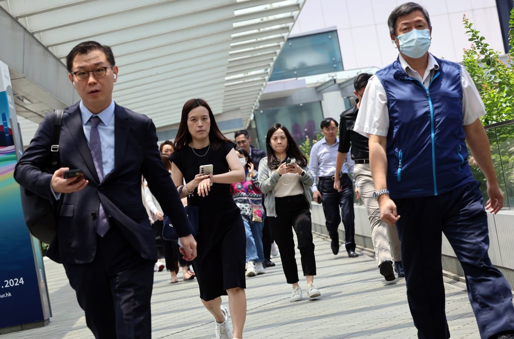 Members of Hong Kong’s civil service head for lunch in Admiralty. Photo: Jelly Tse