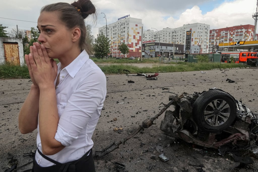 Local resident at a site of a Russian air strike on Kharkiv, Ukraine on Wednesday. Photo: Reuters