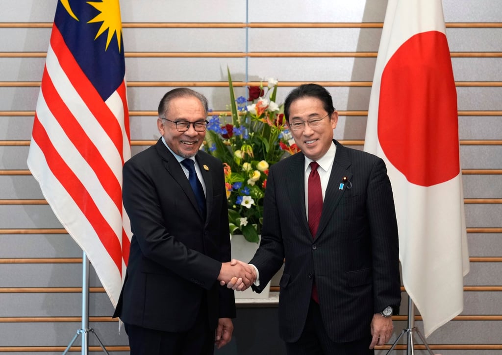 Malaysian Prime Minister Anwar Ibrahim (left) and Japanese Prime Minister Fumio Kishida shake hands at the start of their meeting at the prime minister’s official residence in Tokyo on Thursday. Photo: Pool/EPA-EFE Malaysian Prime Minister Anwar Ibrahim (left) and Japanese Prime Minister Fumio Kishida shake hands at the start of their meeting at the prime minister’s official residence in Tokyo on Thursday. Photo: Pool/EPA-EFE