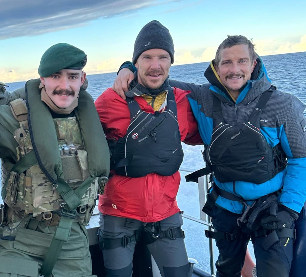Bear Grylls and Benedict Cumberbatch with a royal navy marine. Photo: @beargrylls/Instagram