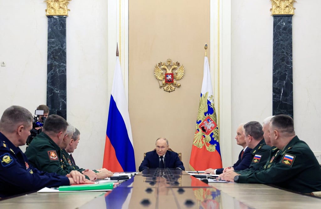 Russian President Vladimir Putin chairs a meeting with commanders. Photo: Sputnik via Reuters