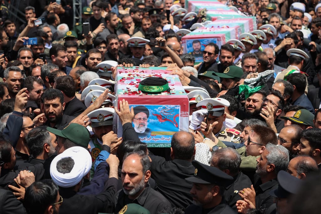 Mourners carry the flag-draped coffins of Iran’s late President Ebrahim Raisi, Foreign Minister Hossein Amir-Abdollahian and others during their funeral ceremony in the city of Mashhad on Thursday. Photo: Iranian Presidency via dpa Mourners carry the flag-draped coffins of Iran’s late President Ebrahim Raisi, Foreign Minister Hossein Amir-Abdollahian and others during their funeral ceremony in the city of Mashhad on Thursday. Photo: Iranian Presidency via dpa