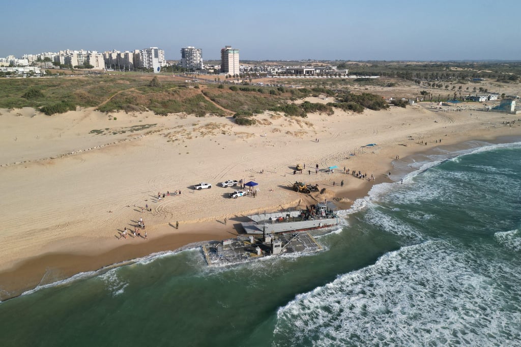 US vessels, used for delivering aid to Palestinians via a new pier in Gaza, are beached on the Mediterranean coast in Ashdod, Israel, on Saturday. Photo: Reuters
