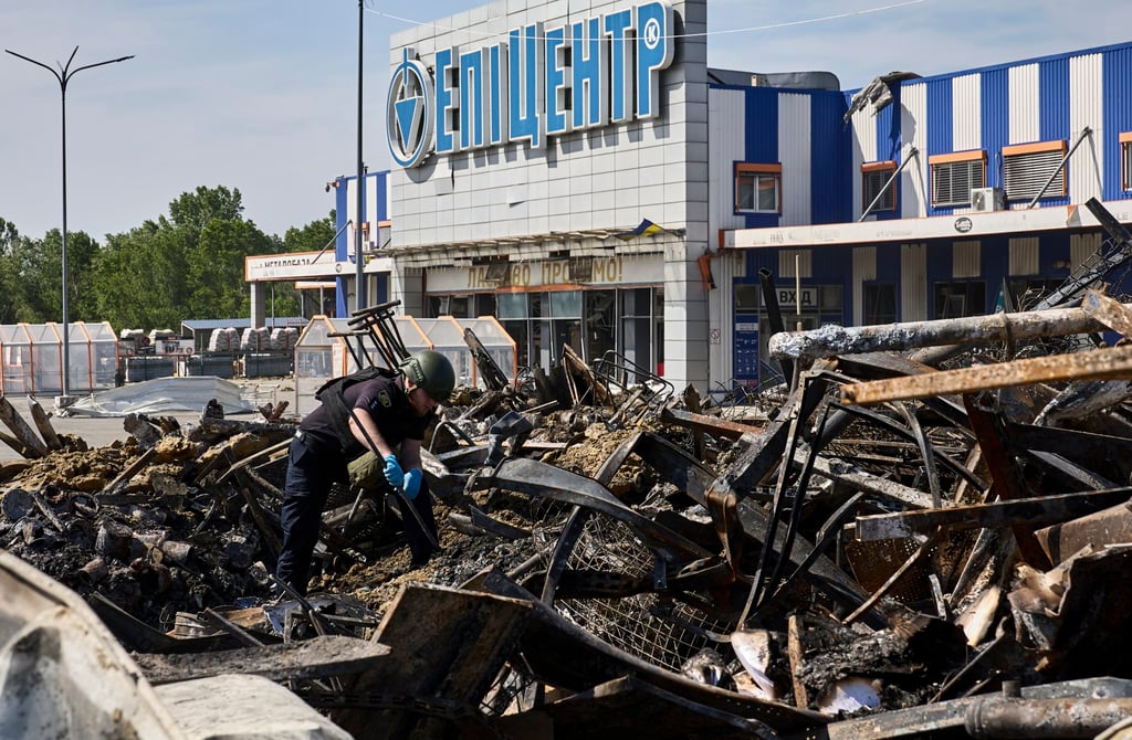 A policeman inspects the damage after the shelling of a DIY shop in Kharkiv, Ukraine on Sunday. Photo: EPA-EFE A policeman inspects the damage after the shelling of a DIY shop in Kharkiv, Ukraine on Sunday. Photo: EPA-EFE