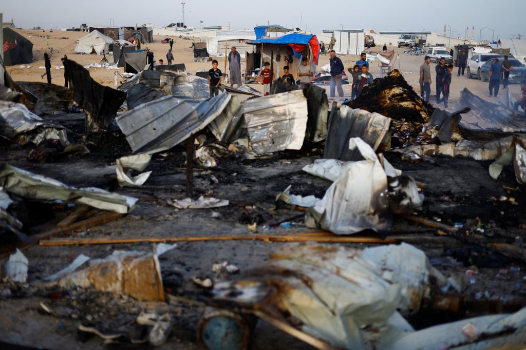 The aftermath of an Israeli strike on an area designated for displaced people. Photo: Reuters The aftermath of an Israeli strike on an area designated for displaced people. Photo: Reuters