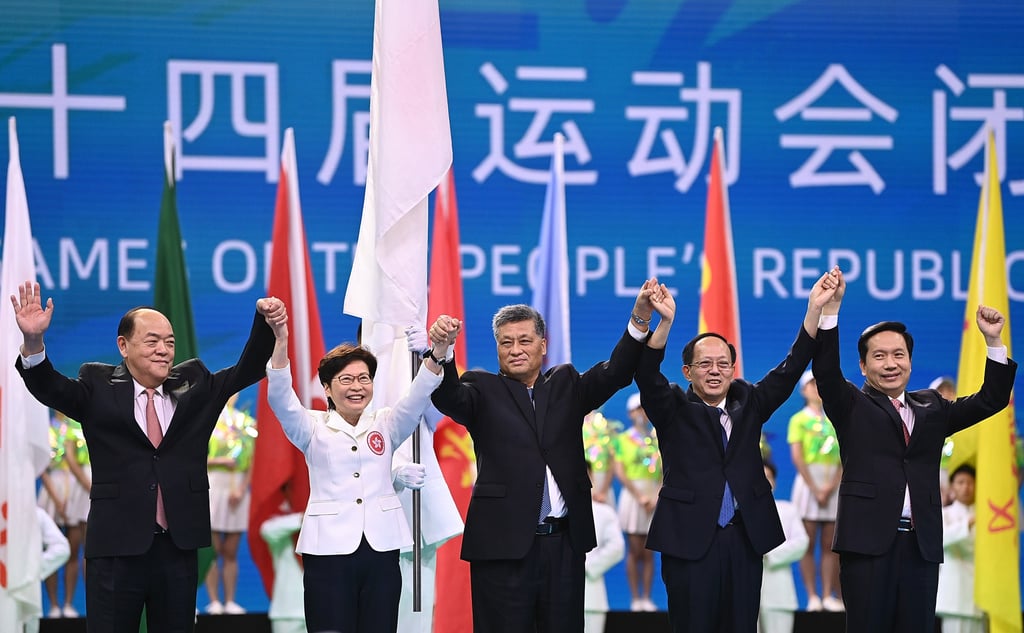 Gou Zhongwen (second from right), retired director of the General Administration of Sport, joins hands during the closing ceremony of the National Games in Xian in 2021. Photo: Xinhua Gou Zhongwen (second from right), retired director of the General Administration of Sport, joins hands during the closing ceremony of the National Games in Xian in 2021. Photo: Xinhua