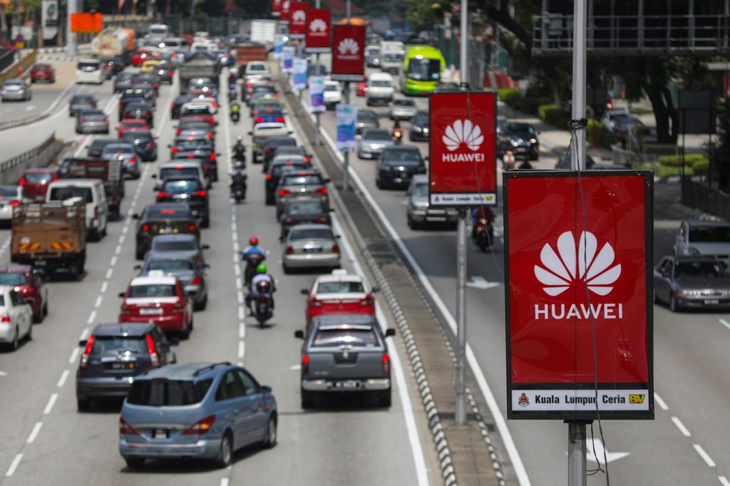 The Huawei logo is seen on advertising hoardings along a road in Kuala Lumpur. Malaysia has refused to rule the Chinese company out of its 5G bidding process despite Western pressure. Photo: EPA-EFE