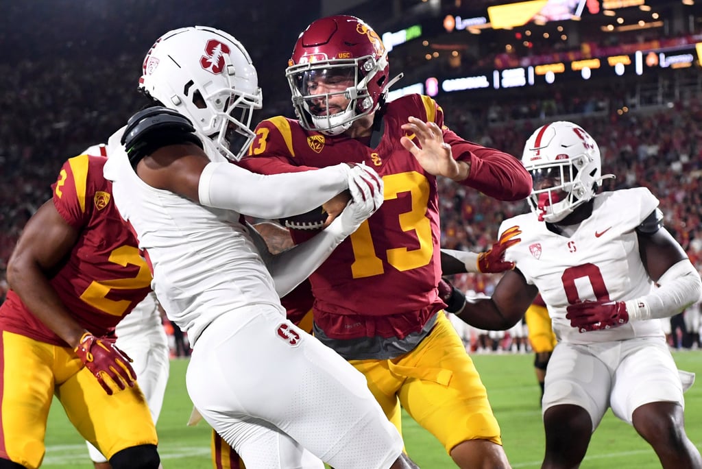 USC Trojans quarterback Caleb Williams pushes his way into the end zone for a touchdown against Stanford in the first quarter at the Los Angeles Memorial Coliseum, in September 2023. Photo: TNS USC Trojans quarterback Caleb Williams pushes his way into the end zone for a touchdown against Stanford in the first quarter at the Los Angeles Memorial Coliseum, in September 2023. Photo: TNS