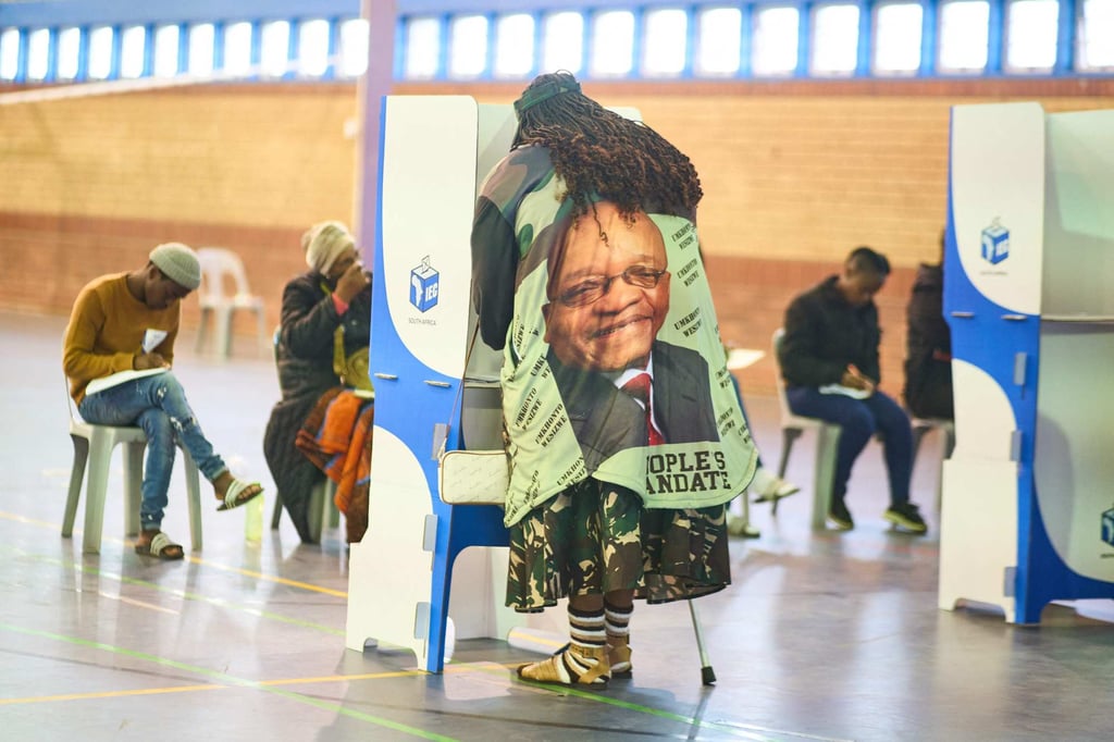 A voter wearing a shirt with the image of ex-South African leader Jacob Zuma marks her ballots in Umlazi on Wednesday. Photo: AFP A voter wearing a shirt with the image of ex-South African leader Jacob Zuma marks her ballots in Umlazi on Wednesday. Photo: AFP
