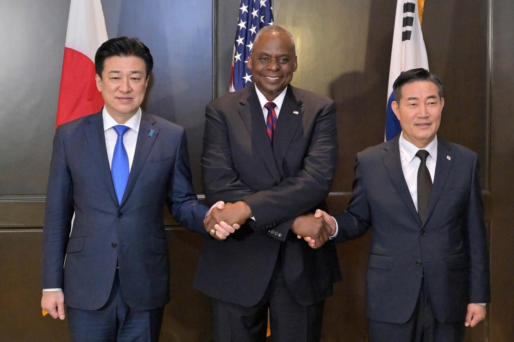 Japan’s Defence Minister Minoru Kihara, US Defence Secretary Lloyd Austin and South Korea’s Defence Minister Shin Won-sik on the sidelines of the Shangri-La Dialogue summit in Singapore. Photo: via AFP