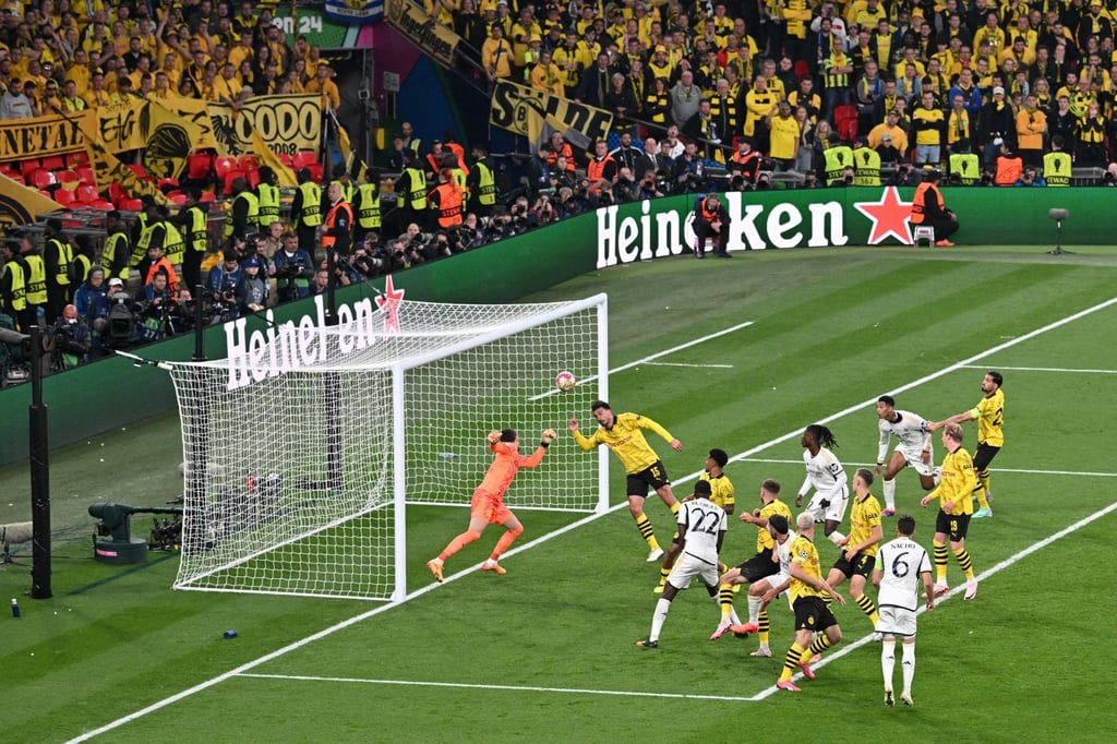 Real Madrid’s Spanish defender Dani Carvajal (centre) scores his side’s first against Borussia Dortmund. Photo: AFP