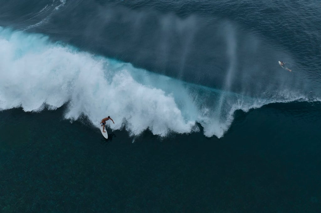 A surfer rides a wave in Teahupo’o, Tahiti. Photo: AP A surfer rides a wave in Teahupo’o, Tahiti. Photo: AP