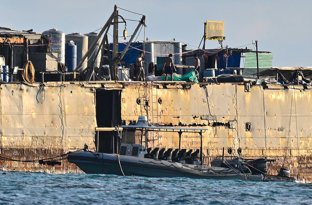 Philippine troops on the Sierra Madre after allegedly removing Chinese fishing nets from nearby waters. Photo: Xinhua Philippine troops on the Sierra Madre after allegedly removing Chinese fishing nets from nearby waters. Photo: Xinhua