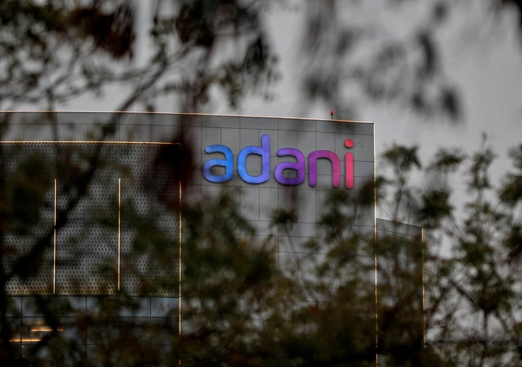 The logo of the Adani Group its corporate headquarters on the outskirts of Ahmedabad. The Adani Group and its founder have maintained that they can execute their ambitious infrastructure projects under any administration. Photo: Reuters The logo of the Adani Group its corporate headquarters on the outskirts of Ahmedabad. The Adani Group and its founder have maintained that they can execute their ambitious infrastructure projects under any administration. Photo: Reuters