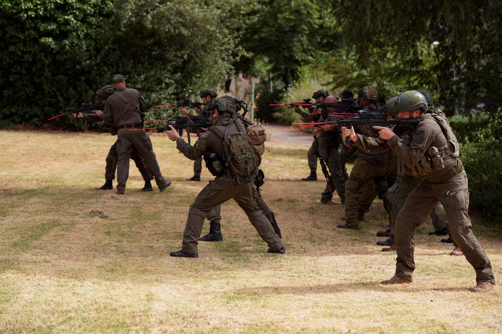 Members of a kibbutz recruited as reservists train amid hostilities between Hezbollah and Israeli forces, in northern Israel. Photo: Reuters