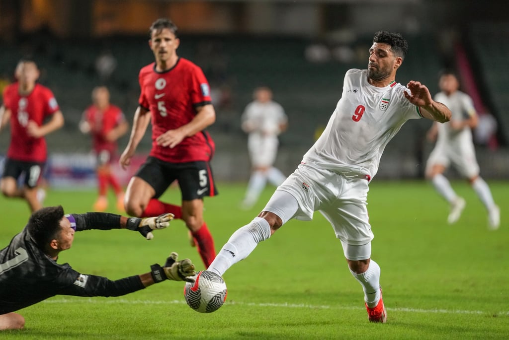 Yapp Hung-fai dives to meet Mehdi Taremi in the incident that led to the second penalty. Photo: Sam Tsang Yapp Hung-fai dives to meet Mehdi Taremi in the incident that led to the second penalty. Photo: Sam Tsang