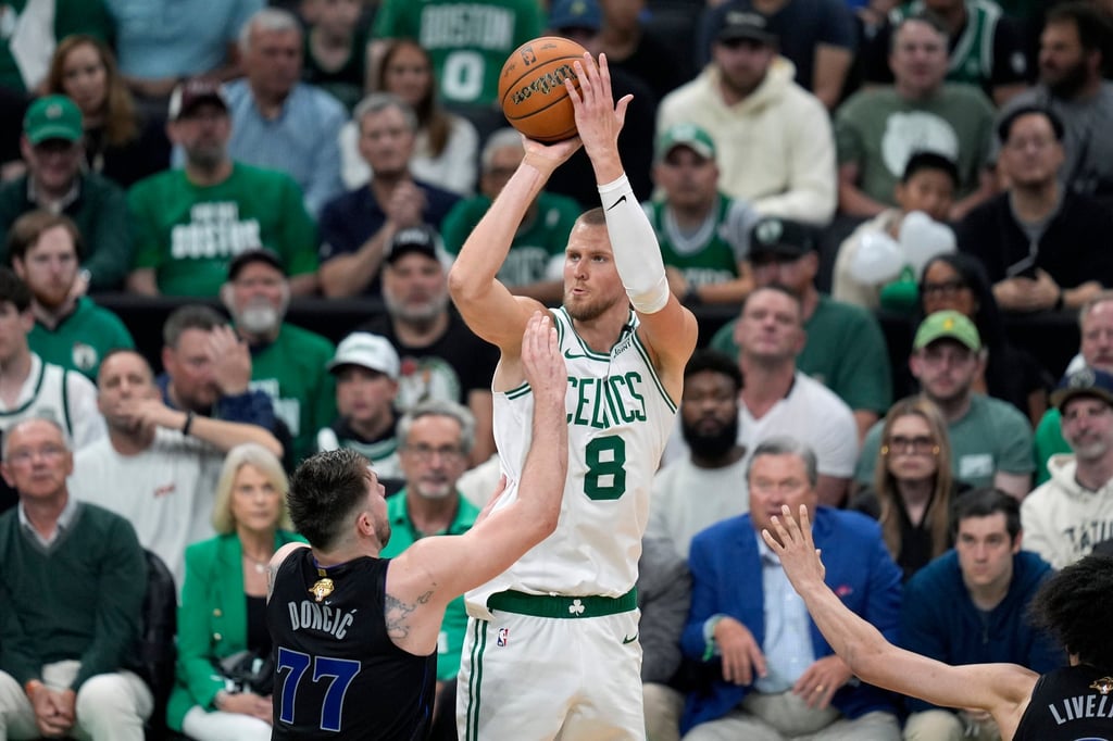 Celtics centre Kristaps Porzingis shoots over Mavericks guard Luka Doncic. Photo: AP
