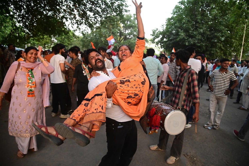 Congress party supporters celebrate vote-counting results for India’s general election, in Chandigarh on Tuesday. Photo: AFP