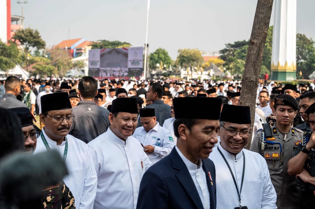 Indonesian President Joko Widodo (front, centre), president-elect Prabowo Subianto (behind) and NU Chairman Yahya Cholil Staquf (right) at an event in Surabaya in October. Photo: AFP Indonesian President Joko Widodo (front, centre), president-elect Prabowo Subianto (behind) and NU Chairman Yahya Cholil Staquf (right) at an event in Surabaya in October. Photo: AFP