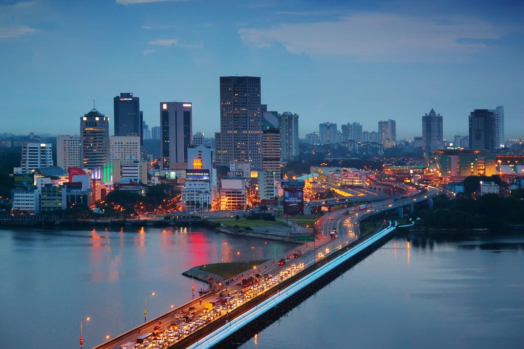 The Malaysian city of Johor Bahru, with heavy traffic seen on the Johor-Singapore Causeway at dusk. Photo: Getty Images The Malaysian city of Johor Bahru, with heavy traffic seen on the Johor-Singapore Causeway at dusk. Photo: Getty Images