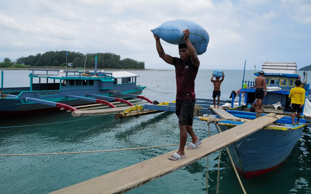 A worker at the port of Santa Ana, Cagayan Valley in the Philippines. Photo: Jeoffrey Maitem A worker at the port of Santa Ana, Cagayan Valley in the Philippines. Photo: Jeoffrey Maitem