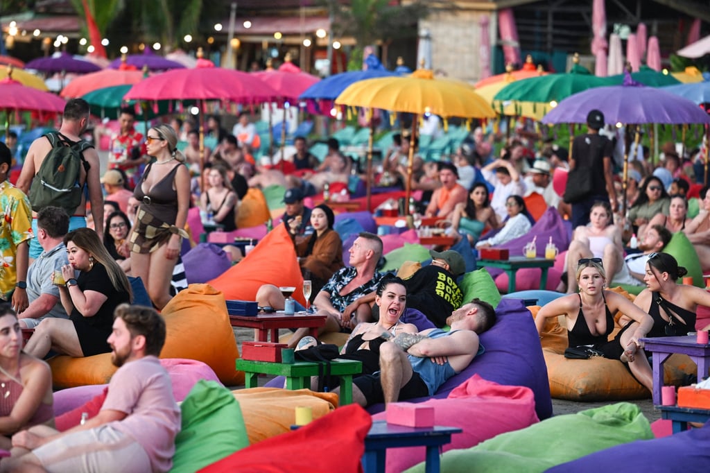 Foreign tourists relax on Bali’s Kuta Beach. Some visitors welcomed the recent etiquette reminder. Photo: AFP Foreign tourists relax on Bali’s Kuta Beach. Some visitors welcomed the recent etiquette reminder. Photo: AFP
