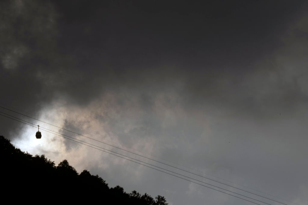 A cable car is seen as monsoon clouds gather over Kathmandu on Sunday. Meteorologists have forecast heavier-than-average rains for Nepal’s monsoon season this year. Photo: EPA-EFE A cable car is seen as monsoon clouds gather over Kathmandu on Sunday. Meteorologists have forecast heavier-than-average rains for Nepal’s monsoon season this year. Photo: EPA-EFE