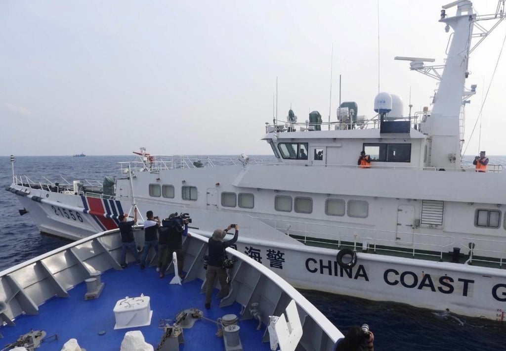 A Chinese coastguard ship next to a Philippine coastguard patrol ship in the disputed South China Sea last October. Photo: EPA-EFE