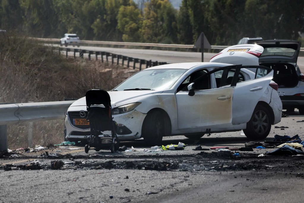 Cars and a stroller near the Israeli kibbutz of Kfar Aza, after an attack by Hamas militants on October 7, 2023. File photo: AFP