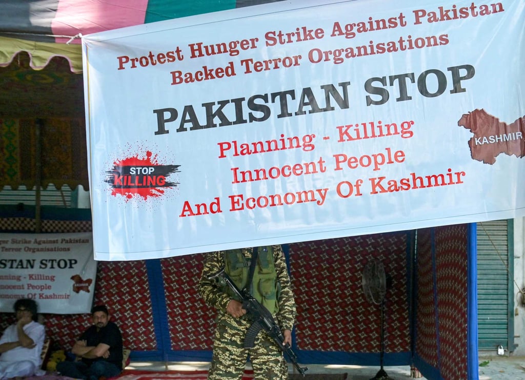 An Indian paramilitary trooper stands guard in Srinagar as Bharatiya Janata Party activists protest on Tuesday against the killing of Hindu pilgrims in Reasi, Indian-administered Kashmir. Photo: AFP An Indian paramilitary trooper stands guard in Srinagar as Bharatiya Janata Party activists protest on Tuesday against the killing of Hindu pilgrims in Reasi, Indian-administered Kashmir. Photo: AFP