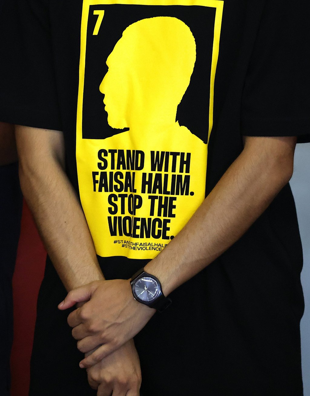 A man wears T-shirt with the slogan ‘Stand With Faisal Halim. Stop The Violence’ during the press conference. Photo: Reuters A man wears T-shirt with the slogan ‘Stand With Faisal Halim. Stop The Violence’ during the press conference. Photo: Reuters