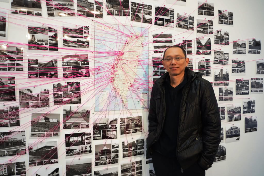 Yao Jui-chung with a map showing the locations of abandoned public buildings around Taiwan at Murray Art Museum Albury, in Australia, in 2017. Photo: Wen Chih-yin